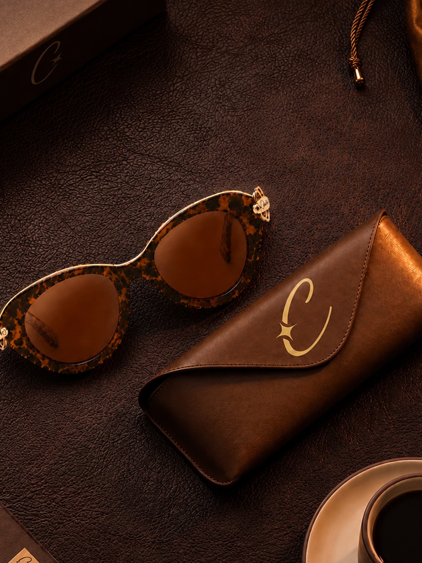Celeste frame and leather case arranged beside coffee