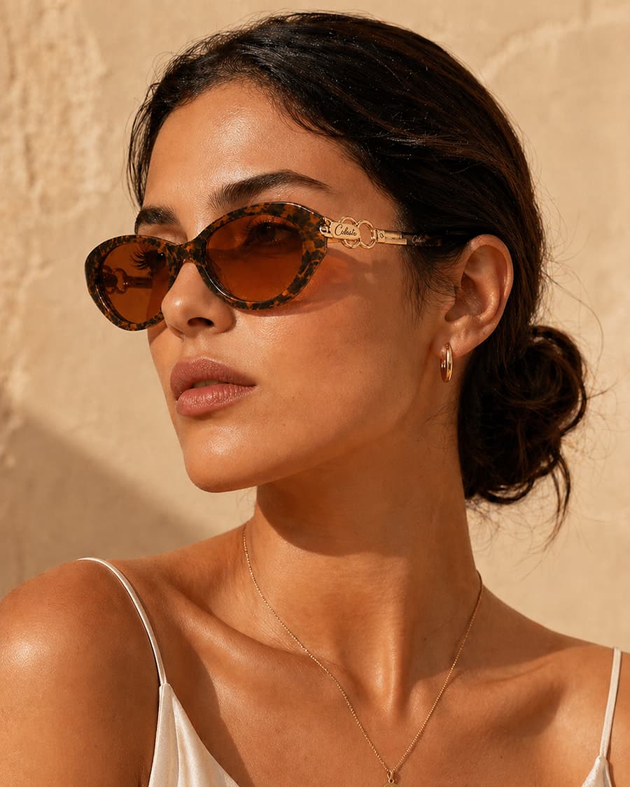 Model wearing Celeste rose-tinted eyewear in warm afternoon light