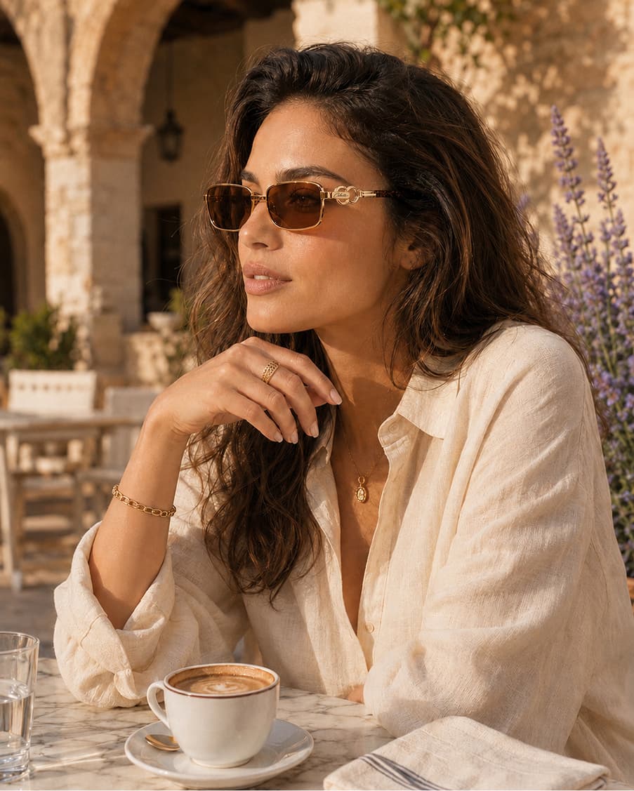 Model in Celeste eyewear seated at a quiet afternoon café